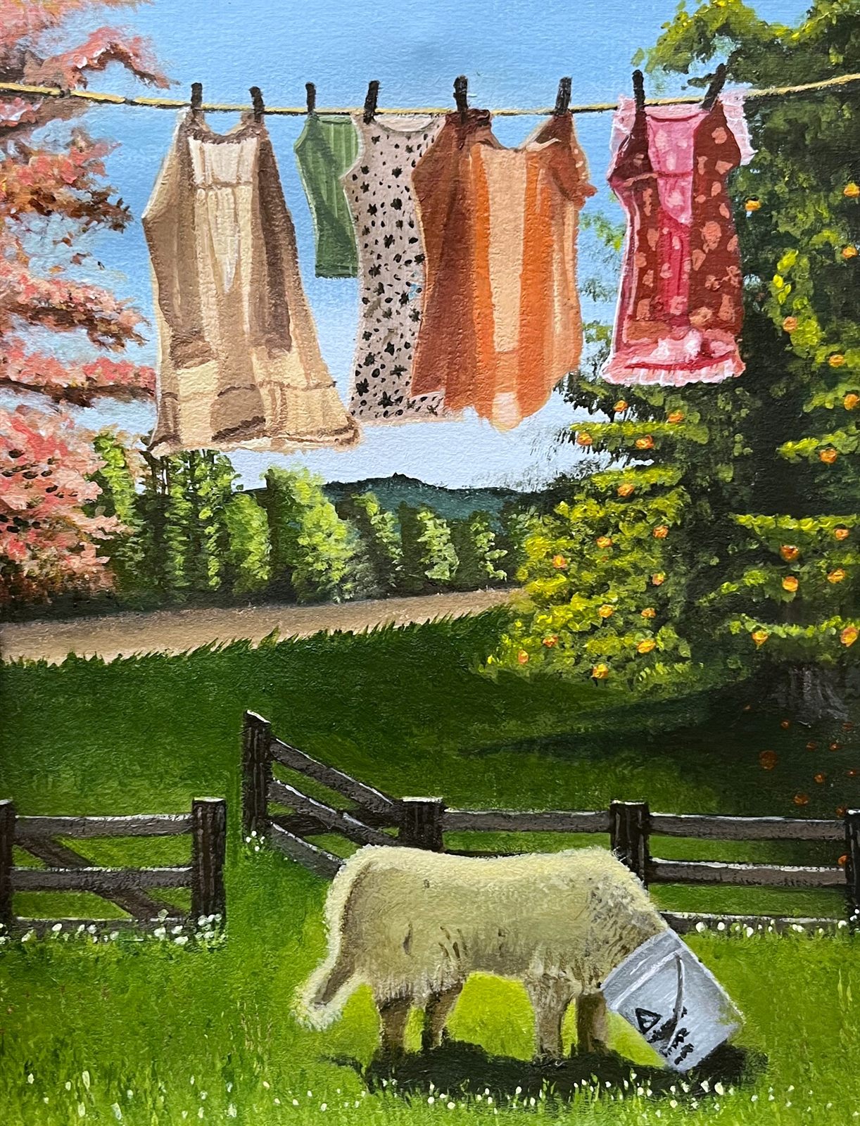 Quiet Life, an acrylic painting of washing hanging on a line against a blue sky, with blossom and orchard trees either side and a sheep grazing in the field below