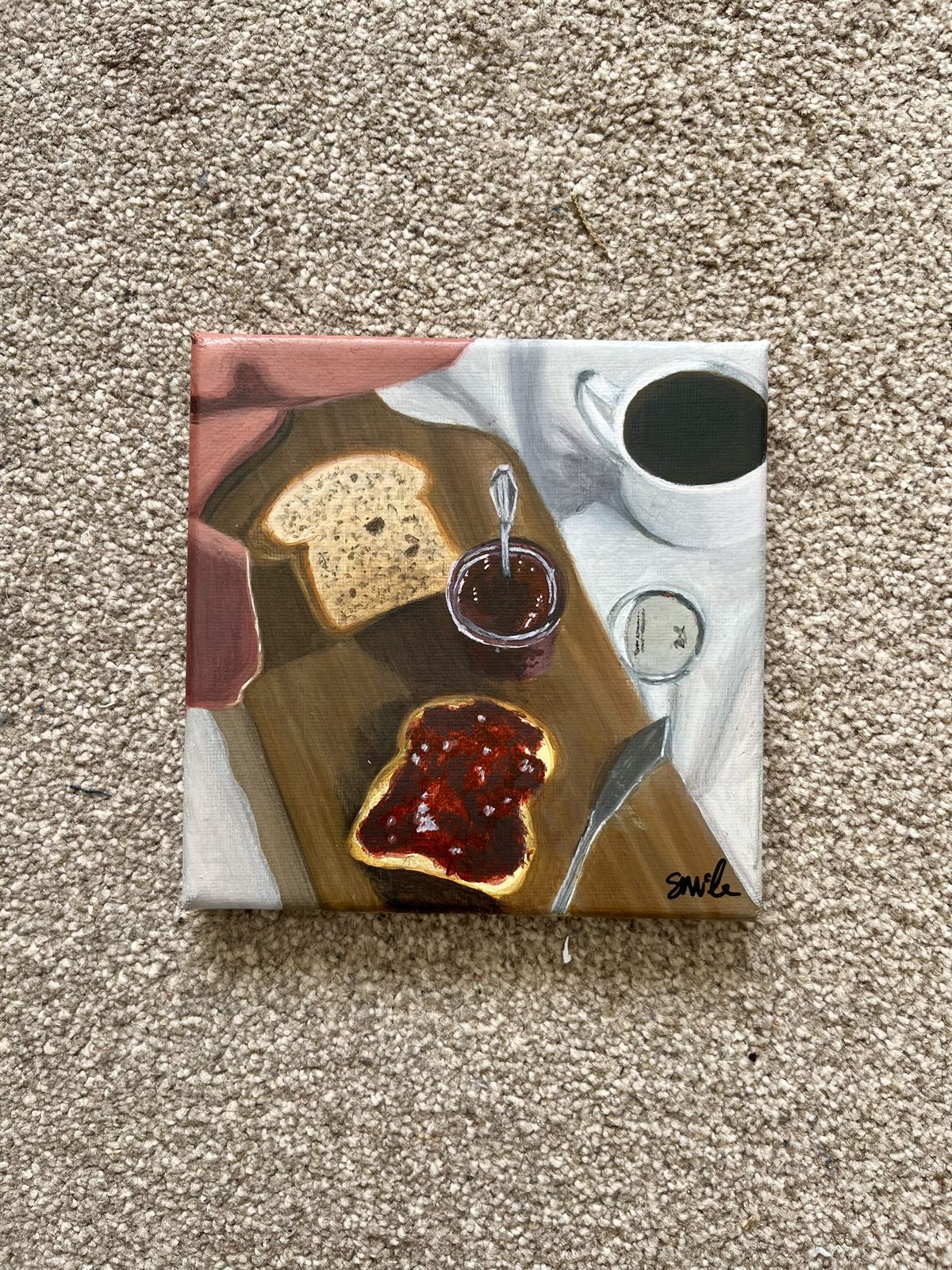 The Strawberry Jam canvas laid flat, showing the whole painting and the signature in the bottom corner