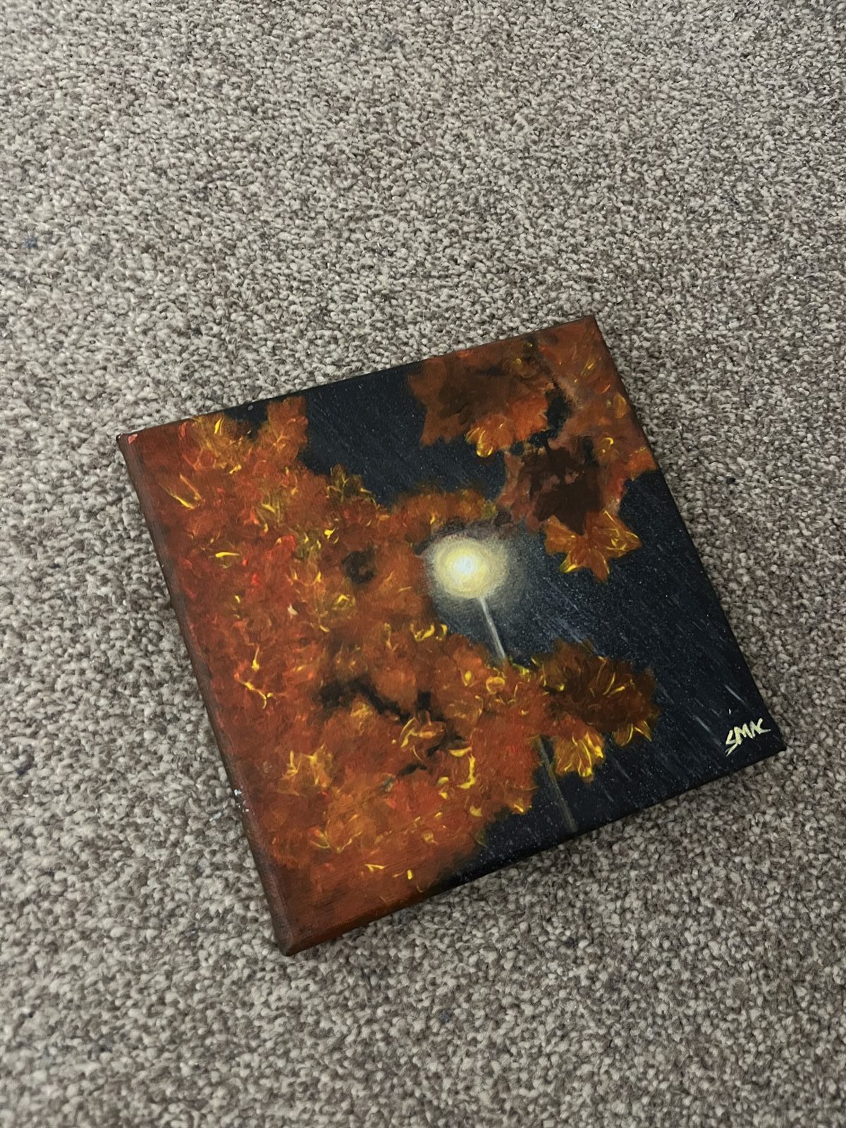 The Walking Home canvas laid flat, showing the whole painting and the signature